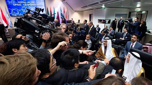 Saudi Arabia's minister of Oil and Mineral Resources Ali al Naimi is surrounded by journalists at an OPEC meeting