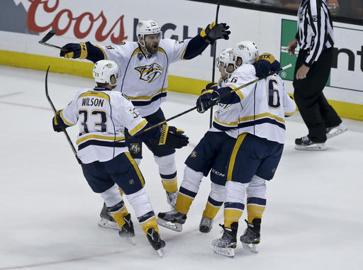 Nashville Predators center Paul Gaustad celebrates with teammates after scoring during the first period of Game 7 in an NHL hockey Stanley Cup playoffs first-round series against the Anaheim Ducks in Anaheim Calif. Wedn