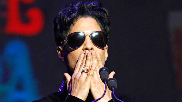 Singer Prince gestures as he announces upcoming live dates at the Apollo Theater in New York