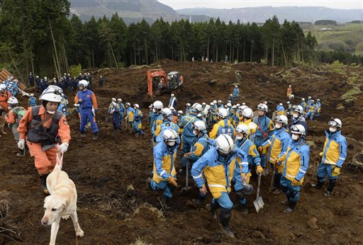 Members of Japan's Self Defense Force search for missing people at a landslide site in Minamiaso Kumamoto prefecture in Japan on Monday. | Takuya Inaba  Kyodo News via AP