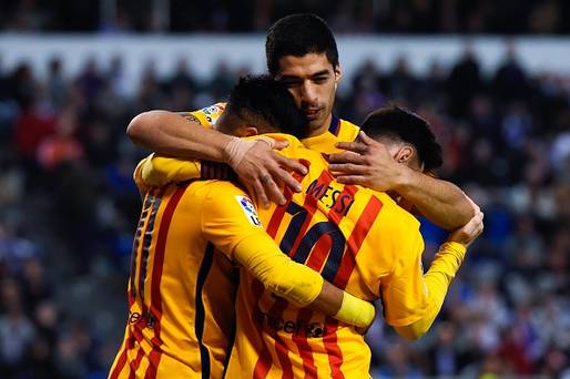 LA CORUNA SPAIN- APRIL 20 Luis Suarez of FC Barcelona embraces his team mates Neymar and Lionel Messi of FC Barcelona after Neymar scores his team's eighth goal during the La Liga match between RC Deportivo La Coruna and FC Barcelona at Riazor