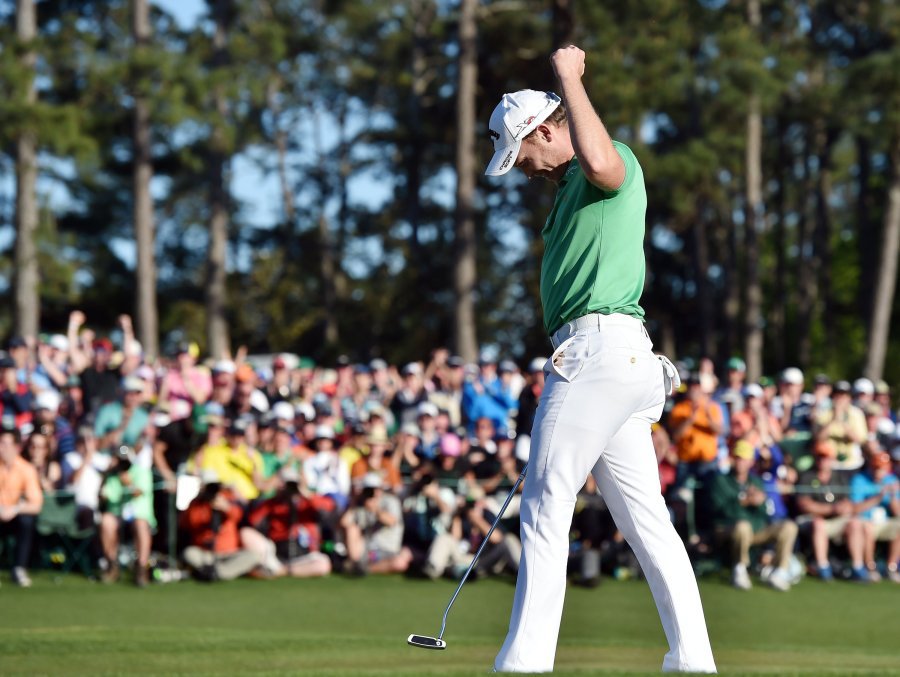 Danny Willett throws his fist in the air on the 18th green after finishing 5-under during the final round of the Masters on Sunday