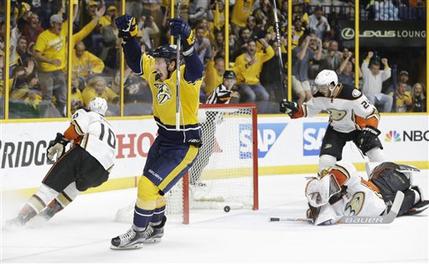 Nashville Predators center Ryan Johansen second from left celebrates a goal by teammate James Neal not shown against Anaheim Ducks goalie Frederik Andersen of Denmark lower right in the second period of Game 6 in an NHL hockey first-round Stanley C