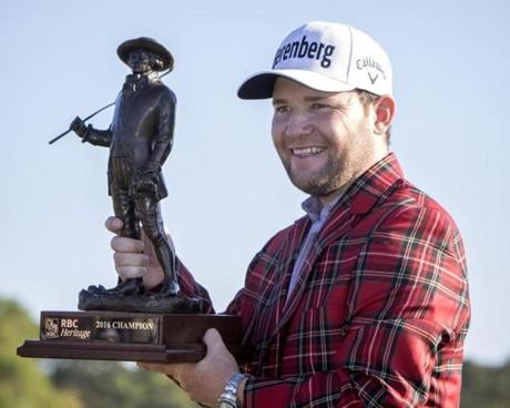 Branden Grace of South Africa holds the RBC Championship trophy after winning the final round of the RBC Heritage golf tournament in Hilton Head Island S.C. Sunday