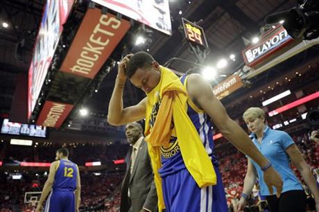 Golden State Warriors&#039 Stephen Curry heads off the court and to the locker room at the start of the second half in Game 4 of a first-round NBA basketball playoff series against the Houston Rockets Sunday