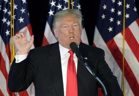 Republican presidential candidate Donald Trump addresses an audience during a campaign rally Monday