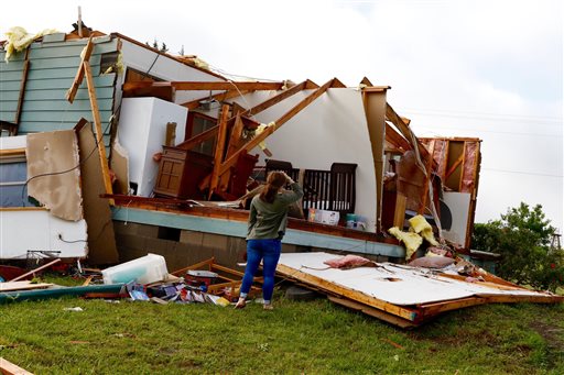 Terri and Terry Calhoun said they were in bed when high winds tore off their roof and caused major damage to their property. (David Woo  The Dal