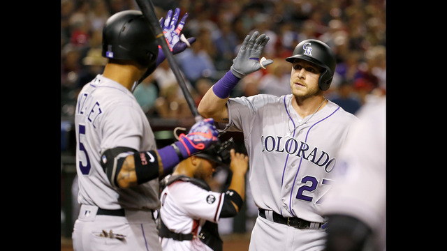 Story hits 2 HRs in debut as Rockies win