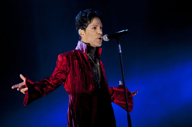 U.S. musician Prince performs during his concert at the Sziget Festival on the Shipyard Island northern Budapest Hungary. The enigmatic star flew into London on Tuesday Feb. 4 2014 at the start of a still-evolving str