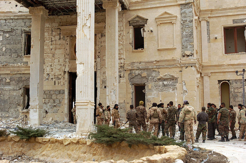 Syrian government troops assemble on the outskirts of Palmyra