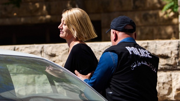 Tara Brown is escorted from court on Monday in Beirut