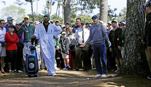 Jordan Spieth waits to hit out of the rough on the third hole during the third round of the Masters golf tournament Saturday