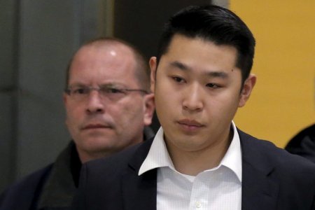 New York City Police officer Peter Liang is led from the court room at the Brooklyn Supreme court in New York in this file