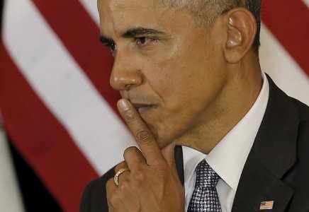 U.S. President Barack Obama listens to remarks at the University of Chicago Law School in Chicago Illinois United States