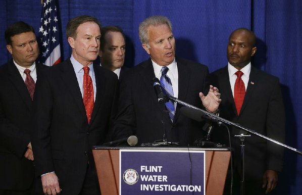 3 charged with several crimes in Flint water crisis