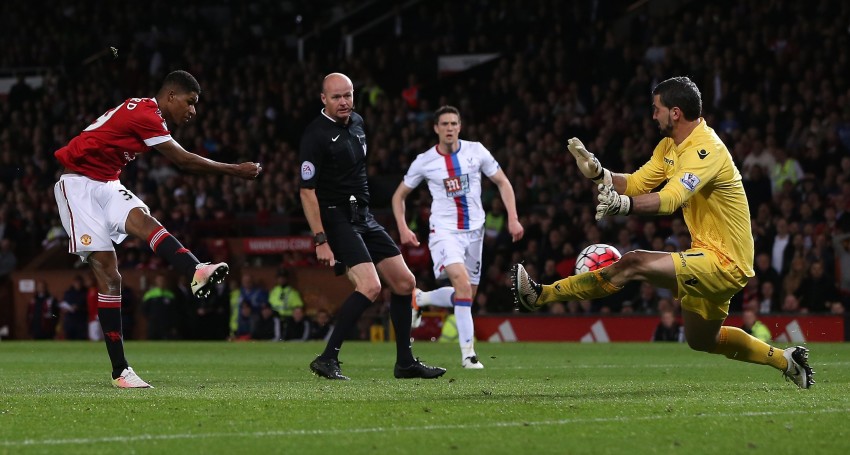 Manchester United's Marcus Rashford has his shot saved by Cr