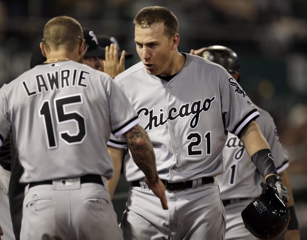 Chicago White Sox's Todd Frazier right celebrates with Brett Lawrie after hitting a three-run home run off Oakland Athletics Chris Bassitt during the fifth inning of a baseball game Tuesday