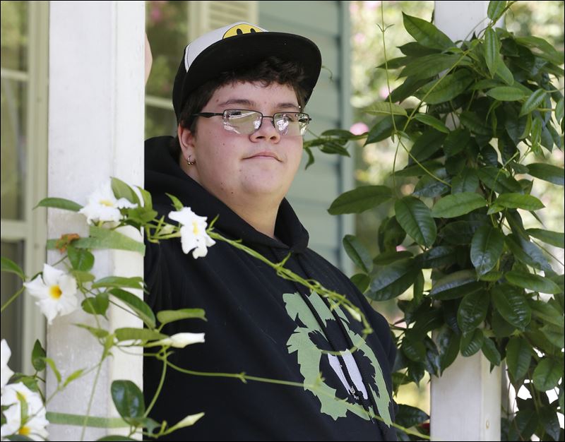 Gavin Grimm sits on his front porch during an interview at his home in Gloucester Va. A U.S. appeals court has overturned a policy barring a transgender student from using the boys&#39 restrooms at his Virginia high school