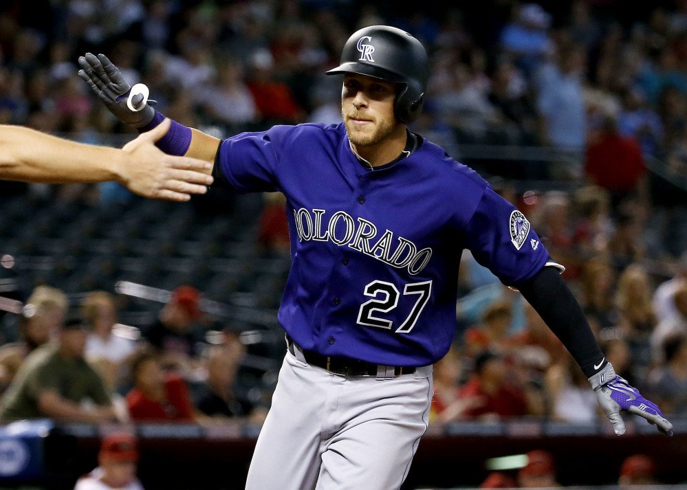 Colorado's Trevor Story celebrates after hitting a two-run homer in the first inning of the Rockies 4-3 road win against Arizona on Wednesday. Story has homered in each of his first three games