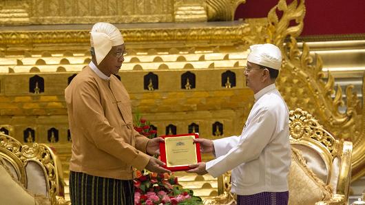 Myanmar's new president Htin Kyaw receives the presidential seal from outgoing president Thein Sein during a handover ceremony in Naypyitaw