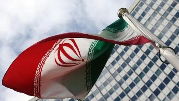 An Iranian flag flutters in front of the United Nations headquarters during an International Atomic Energy Agency board of governors meeting in Vienna