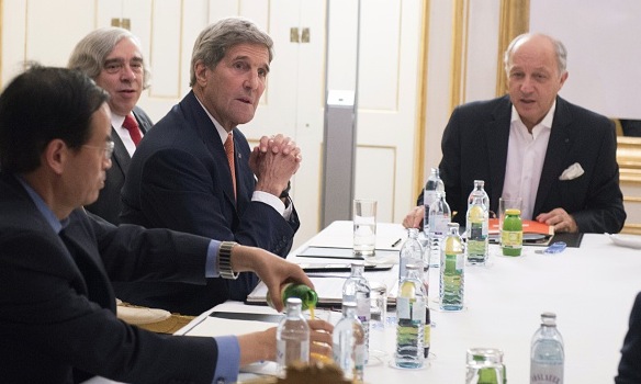 US Secretary of State John Kerry, US Secretary of Energy Ernest Moniz and French Foreign Minister Laurent Fabius meet at the Palais Coburg Hotel where the Iran nuclear talks are being held in Vienna Austria