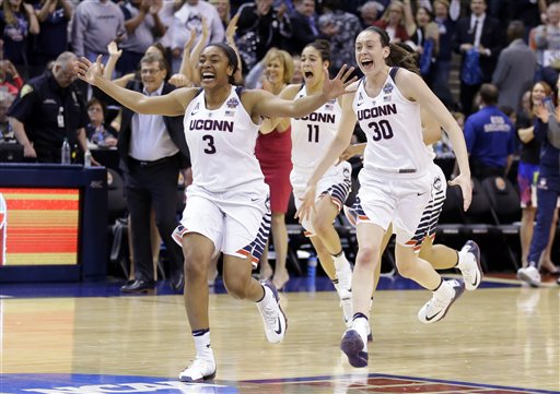 Connecticut's Morgan Tuck, Kia Nurse and Breanna Stewart celebrate after Connecticut's 82-51 victory over Syracuse in the championship game at the women's Final Four in the NCAA college basketball tournament Tuesday April 5