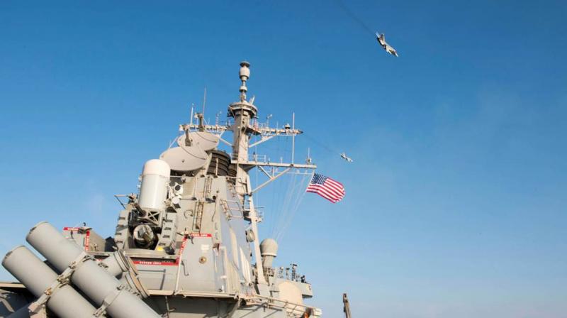 Two Russian Sukhoi Su-24 attack aircraft make a low altitude pass by the USS Donald Cook in the Baltic Sea