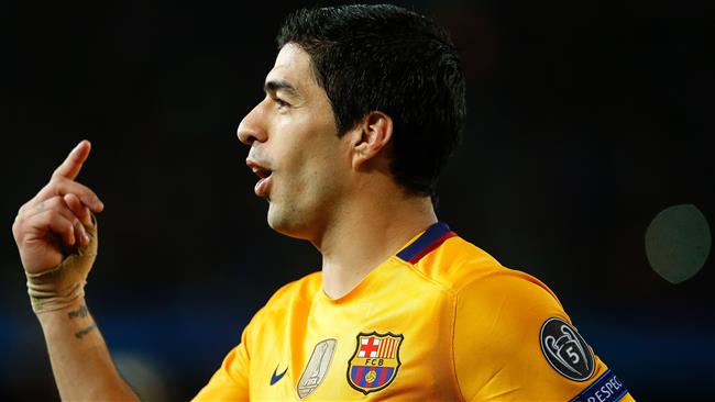 Uruguayan ace Luis Suarez lifts Barcelona to victory over Atletico Madrid after Torres red