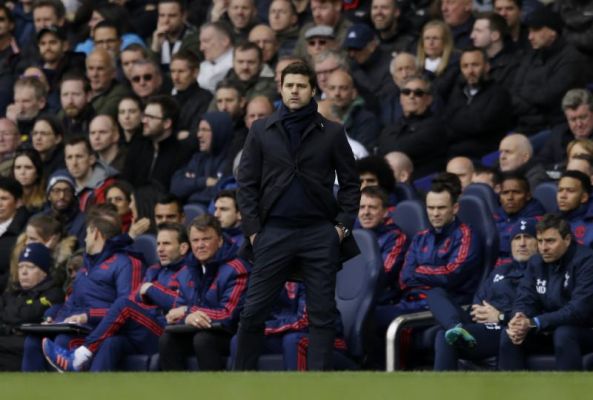 Tottenham Hotspur's head coach Mauricio Pochettino center watches