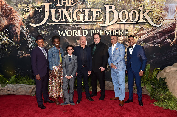 HOLLYWOOD CALIFORNIA- APRIL 04  Actors Giancarlo Esposito Lupita Nyong'o Neel Sethi Sir Ben Kingsley director Jon Favreau actors Russell Peters and Ritesh Rajan attend The World Premiere of Disney's'THE JUNGLE BOOK at the El Capi