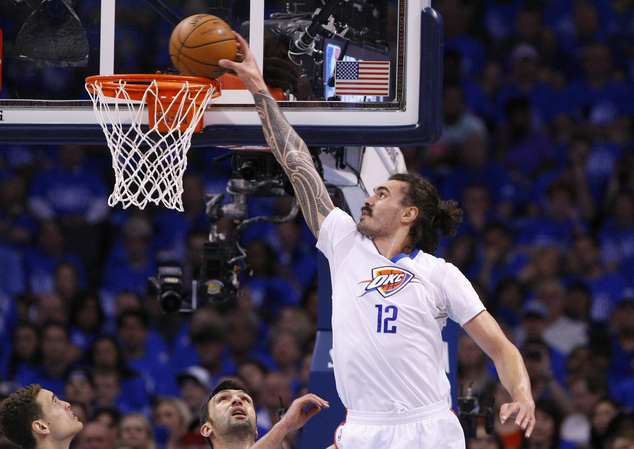 Oklahoma City Thunder center Steven Adams goes up for a basket against the Dallas Mavericks during the first half of Game 5 of a first-round NBA basket