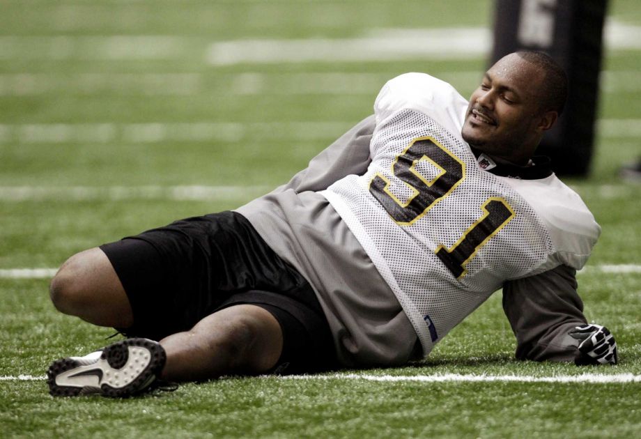 New Orleans Saints defensive end Will Smith stretches during practice at their NFL football training facility in Metairie La. Former New Orleans Saints player Will Smith was shot in the back and side according