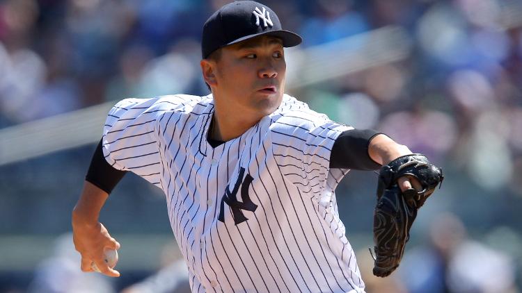 New York Yankees starting pitcher Masahiro Tanaka pitches against the Seattle Mariners during the first inning at Yankee Stadium