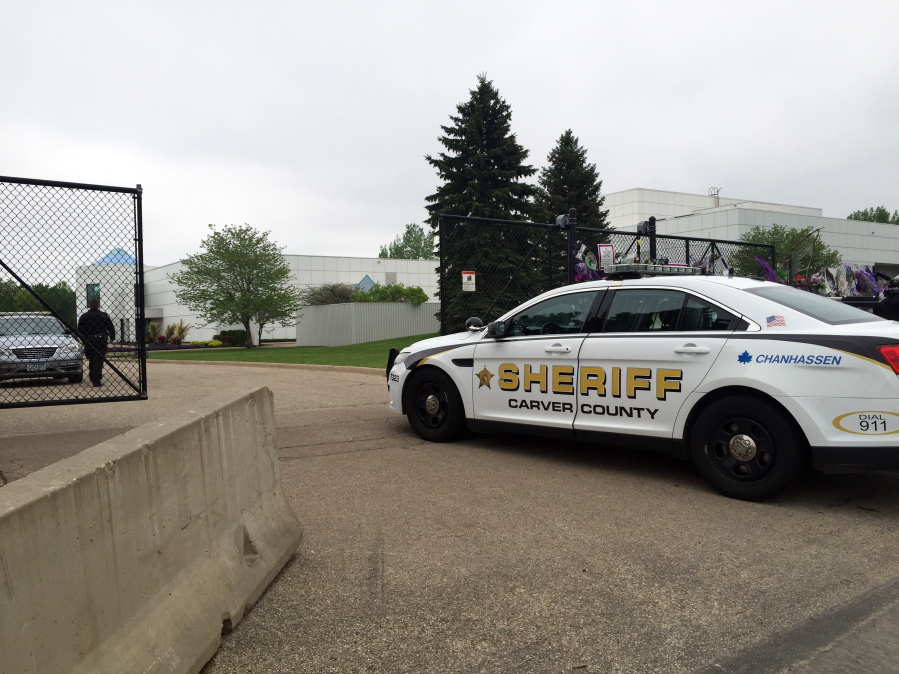 A Carver County Sheriff's vehicle enters Prince's Paisley Park home and studio Tuesday in Chanhassen Minn