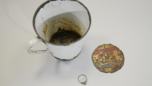 A gold ring that was found by curators of Auschwitz- Birkenau Museum in a metal mug with a double bottom