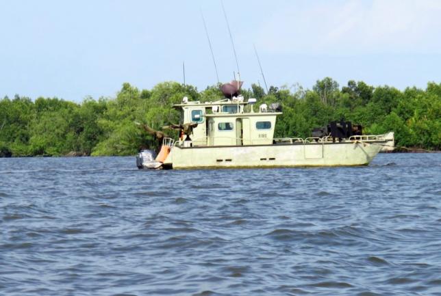 A military gunboat is seen on a river in Nigeria's Delta regi