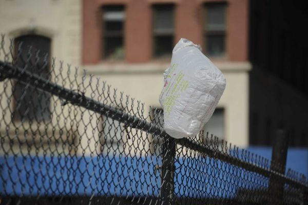 A plastic bag stuck on a fence