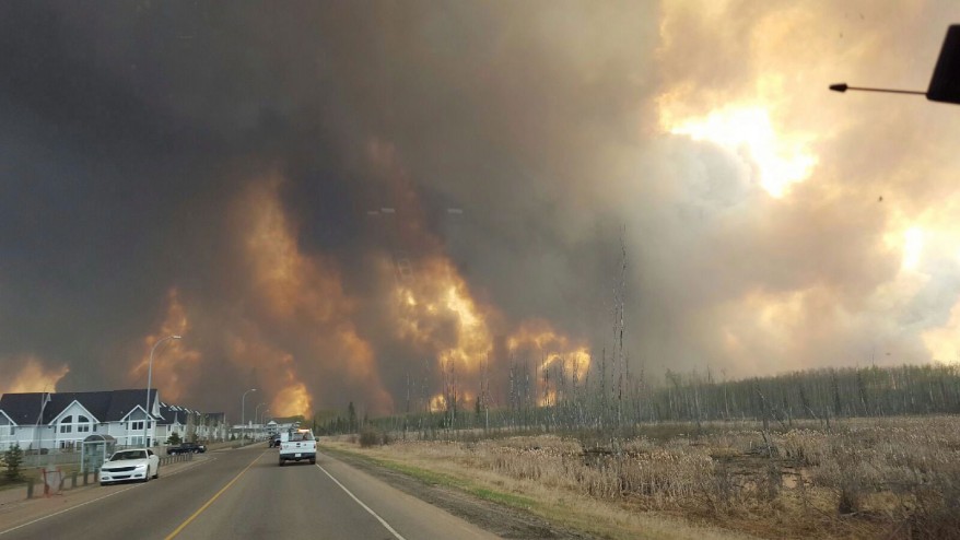 A wall of fire rages outside of Fort McMurray Alta. as a wildfire threatened the city