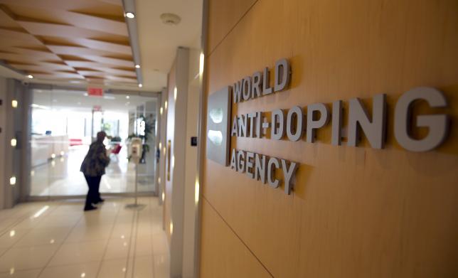 A woman walks into the head office for the World Anti Doping Agency in Montreal Quebec Canada