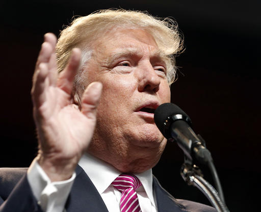 Republican presidential candidate Donald Trump gestures during a rally in Charleston