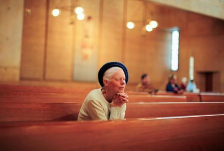 People pray after learning of the newly elected Pope Francis at the Cathedral of Our Lady of the Angels in Los Angeles California