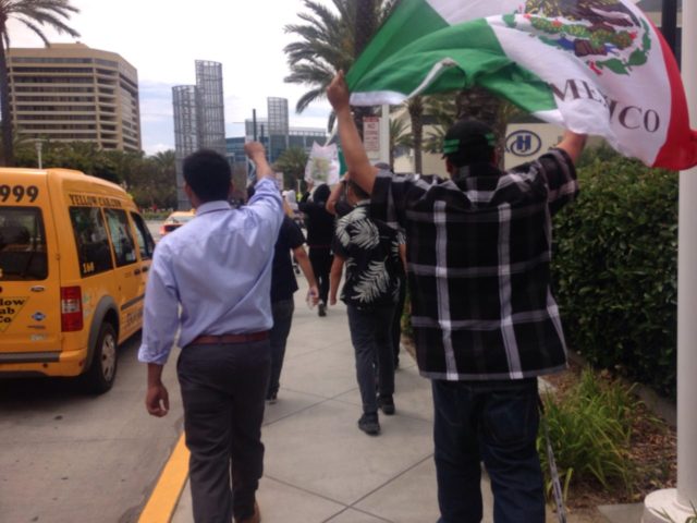 Latinos protest Donald Trump with Mexican flag