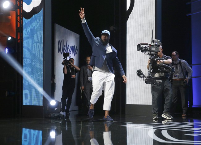 Alabama’s A’Shawn Robinson celebrates after being selected by the Detroit Lions as the 46th pick in the second round of the 2016 NFL football draft Friday