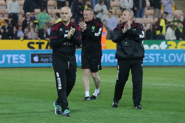 Norwich manager Alex Neil and his backroom team show their appreciation to the home fans after beating Watford 4-2