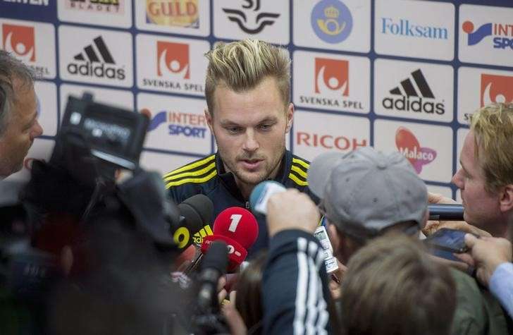 Sweden's national soccer team player Sebastian Larsson talks to media before a training session at the Friends Arena in Stockholm