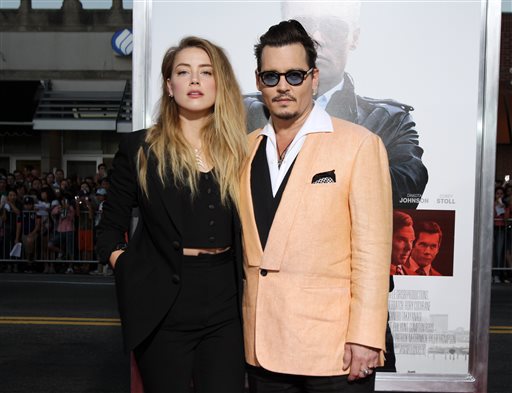 CORRECTS THEATER TO THEATRE- Amber Heard left and Johnny Depp attend at the Special Screening of'Black Mass at the Coolidge Corner Theatre on Tuesday Sept. 15 2015 in Brookline Mass