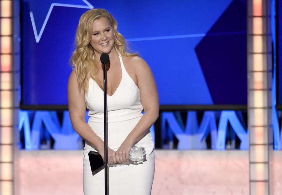 Amy Schumer accepts the award for best actress in a comedy for'Trainwreck at the 21st annual Critics Choice Awards at the Barker Hangar in this file