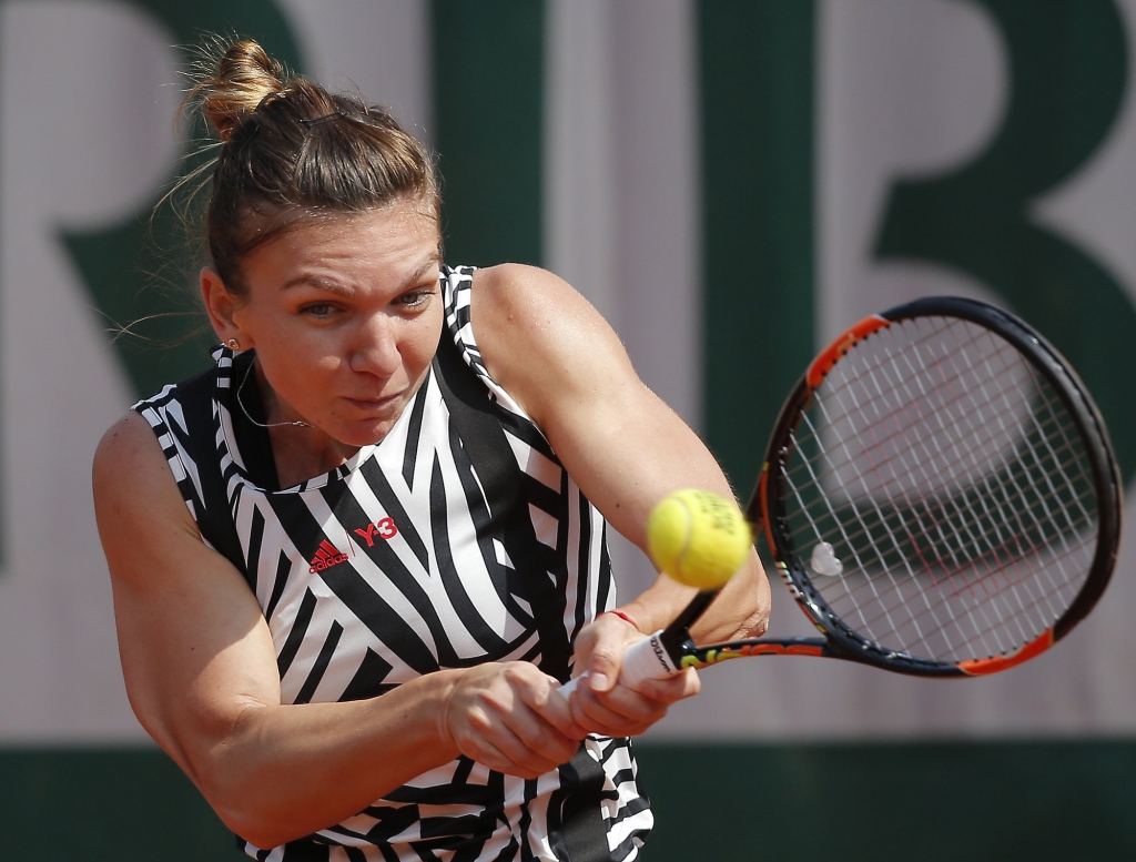 Romania's Simona Halep returns in her third round match of the French Open tennis tournament against Japan ™s Naomi Osaka at the Roland Garros stadium in Paris France Friday