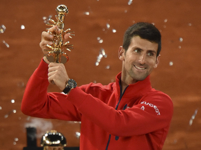 Djokovic poses with his trophy at the Madrid Open